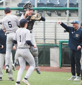 Bainbridge catcher Breckin Hadley chest bumps Coco Black (5) to celebrate their win over Jackson Saturday. Steve Powell/Bainbridge Review photos