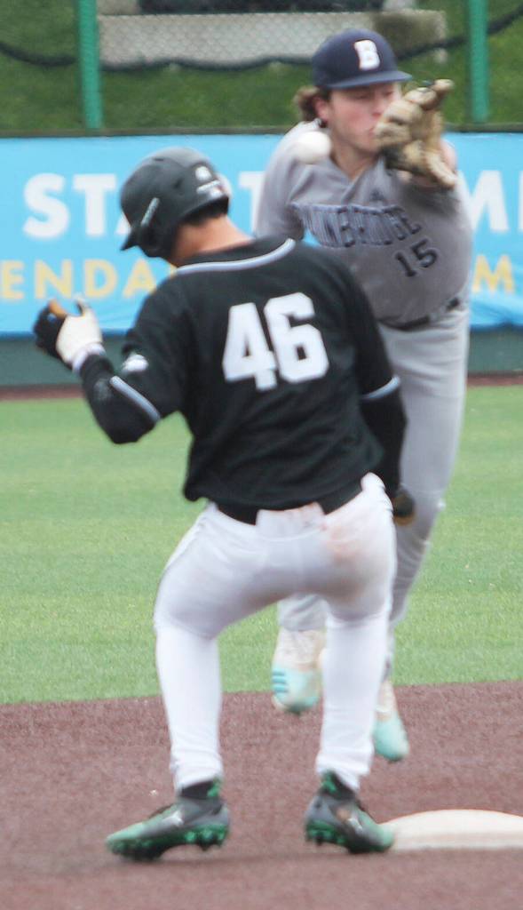 Connor Sweeny (15) tries to pick off Dominic Hellman (46) of Jackson at second base, but the throw was offline, and the Wolf went safely to third.