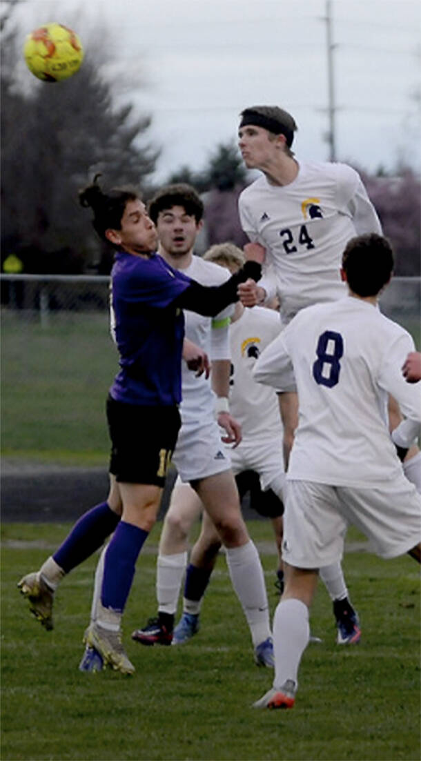 Bainbridges Maximo Youle (24) heads the ball in the 3-0 win over Sequim. Michael Dashiell/Courtesy Photo