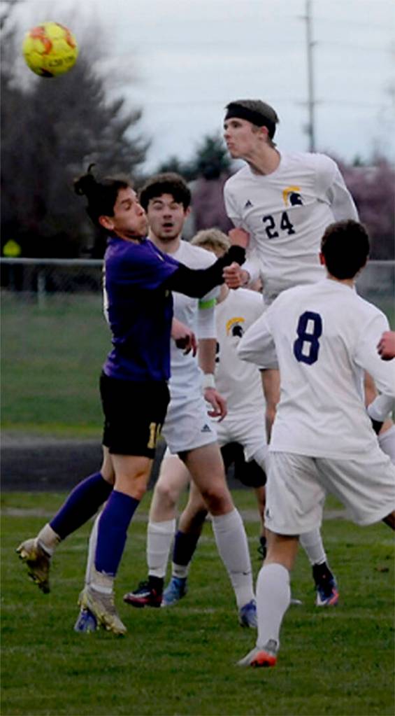 Bainbridges Maximo Youle (24) heads the ball in the 3-0 win over Sequim. Michael Dashiell/Courtesy Photo