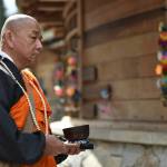 The Rev. Senji Kanaeda at Nipponzan Myohoji Bainbridge Island rang a gong during the reading of the names of the those forced from the island in 1942.