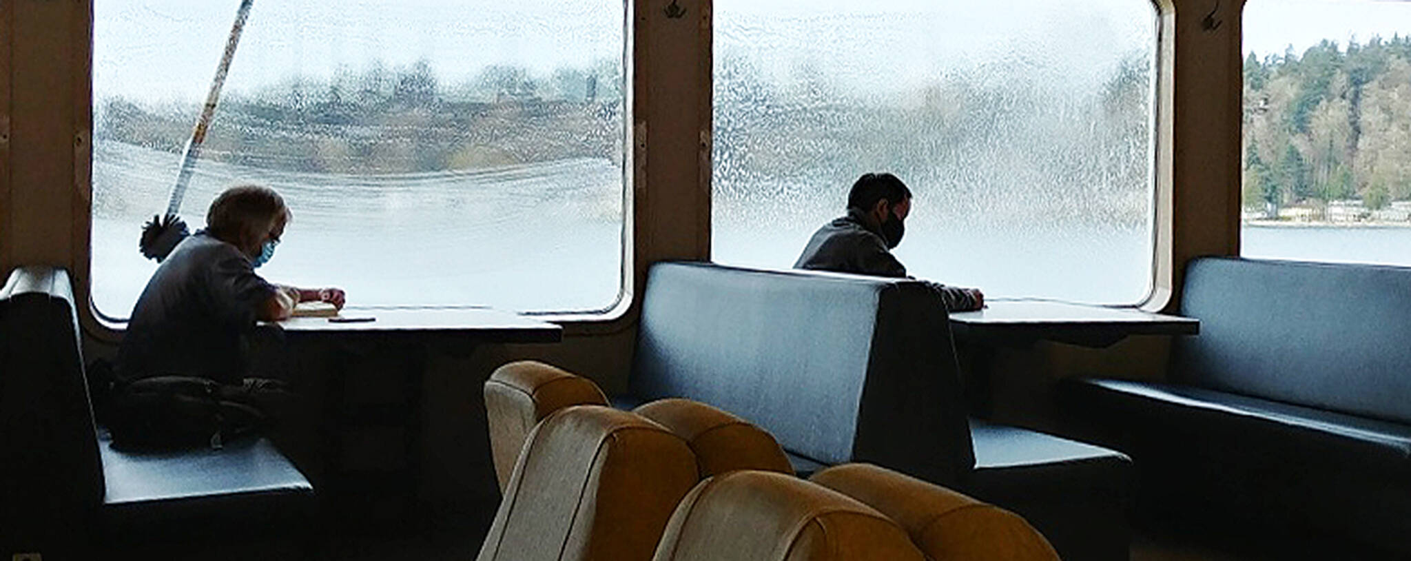 Steve Powell/Bainbridge Island Review
A ferry rider from Seattle to Bainbridge looks like hes getting his back scratched. Actually, ferry workers from the deck above are washing and rinsing the windows.