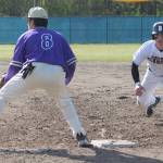 CoCo Black dives safely back to first base after a pickoff attempt. Ethan Gillespie of NK awaits the toss.