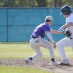 Joey Hildebrandt of Bainbridge is safe in a close play at second base as NKs Cole Edwards applies the tag.