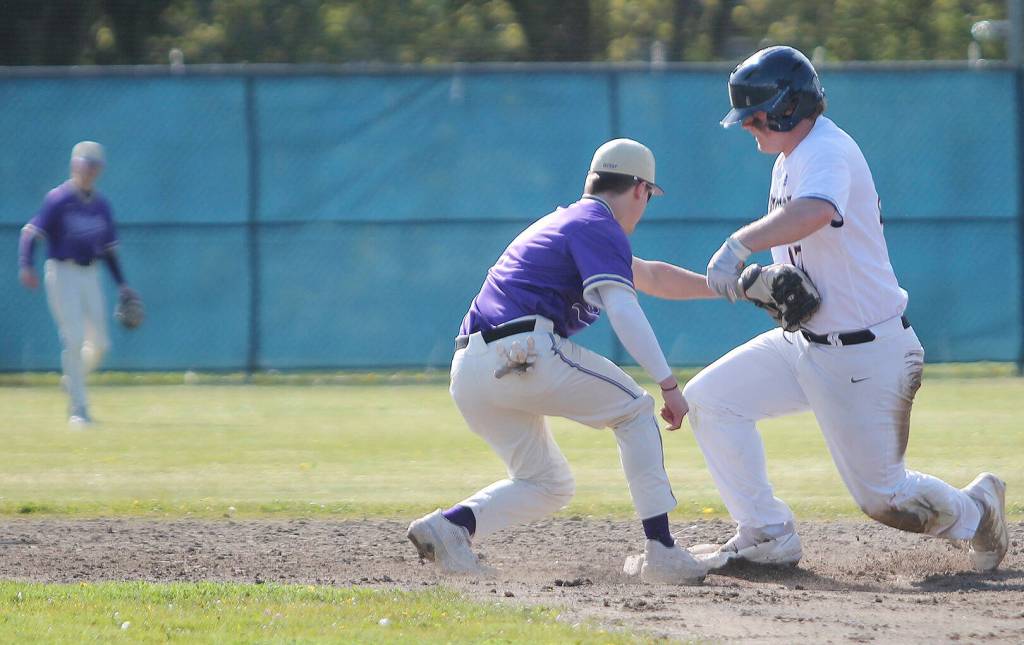 Joey Hildebrandt of Bainbridge is safe in a close play at second base as NKs Cole Edwards applies the tag.