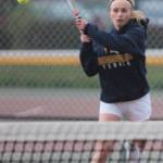 Kristina Walker follows through after a backhand in the Spartans match at Kingston.