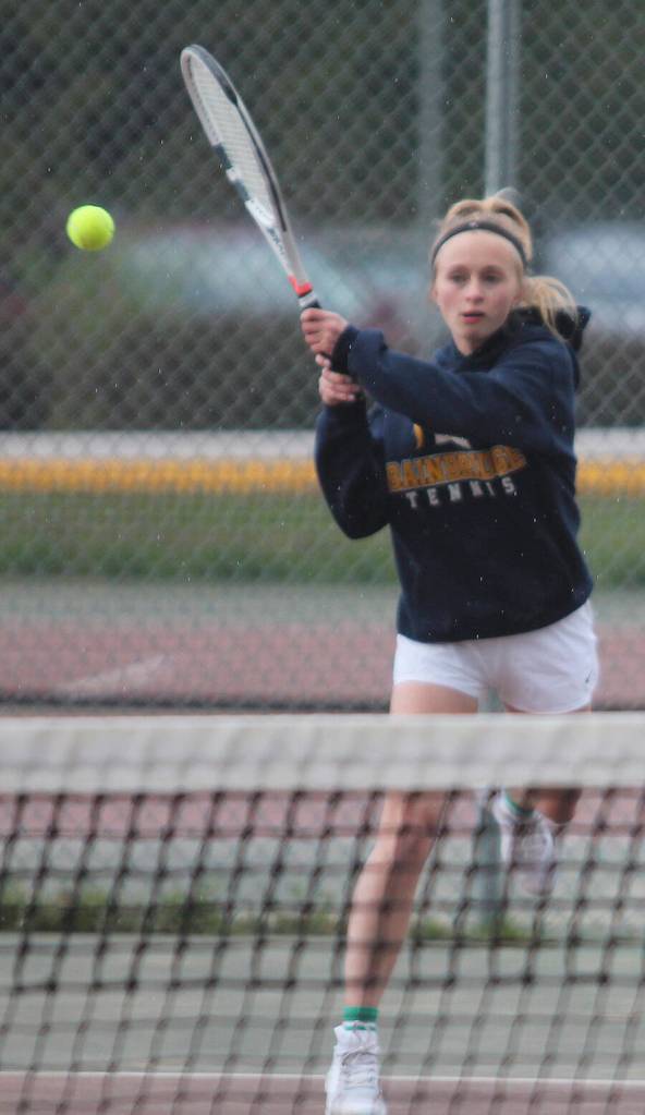 Kristina Walker follows through after a backhand in the Spartans match at Kingston.