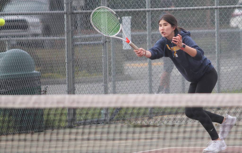 Aya Gatto smashes a forehand down the line against the Bucs.
