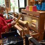 Catherine Camp works at a loom to weave a scarf in the Fiber Arts studio. Nancy Treder/Bainbridge Review photos