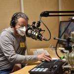 Volunteer Joseph Steck in the Media Arts studio where podcasts are produced.
