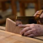 Paul Kury making dovetail cuts for a wooden box.