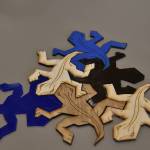 Lasercut puzzle pieces made in the Electronic & Technical Arts studio.
