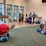 Robots ATLAS and HERMES showcase their capabilities as student drivers operate them from afar.