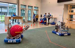 Robots ATLAS and HERMES showcase their capabilities as student drivers operate them from afar.