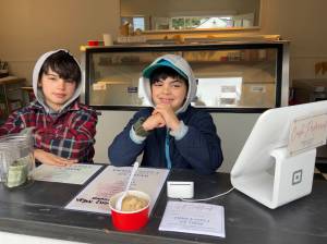 Courtesy Photos
Twin scoopers, Noah and Lucas Rudolph, helping out at Emma & Ottos Ice Cream, which opened last month on Winslow Way.