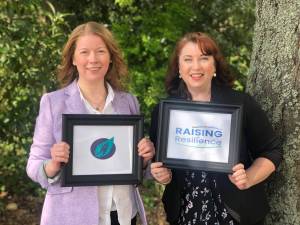 BYS executive director Courtney Oliver and Raising Resilience executive director April Avey announce the merger of their organizations. Courtesy photo