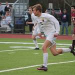 Bainbridges Calvin Moe, a senior midfielder-forward, takes off downfield to try to set up a scoring opportunity against Kingston earlier this season.