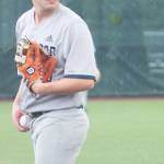 Spartan pitcher Cooper Russell looks back a runner at first.