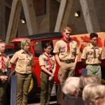 Scouts raise the U.S. flag to full staff during the rededication service.