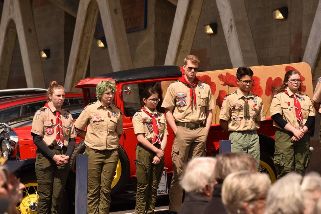 Scouts raise the U.S. flag to full staff during the rededication service.