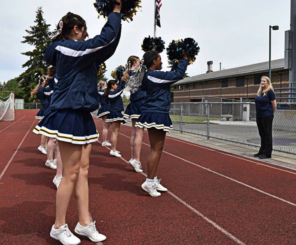 The varsity cheer squad practices its new routine after Jackson allowed them to create their own choreography.