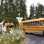 Parents and family members greeted buses with cheers and water balloons as graduating seniors departed Bainbridge Island for the annual Grad Night festivities.  Nancy Treder/Bainbridge Review