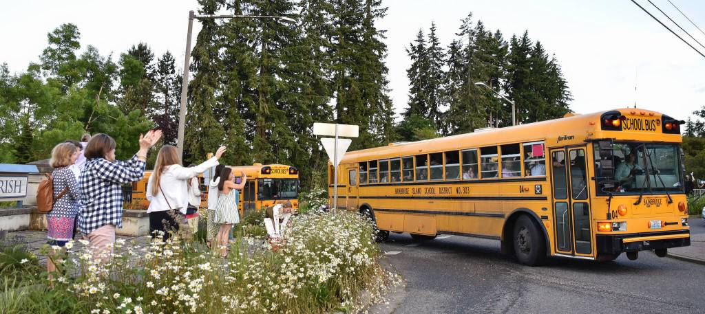 Parents and family members greeted buses with cheers and water balloons as graduating seniors departed Bainbridge Island for the annual Grad Night festivities.  Nancy Treder/Bainbridge Review