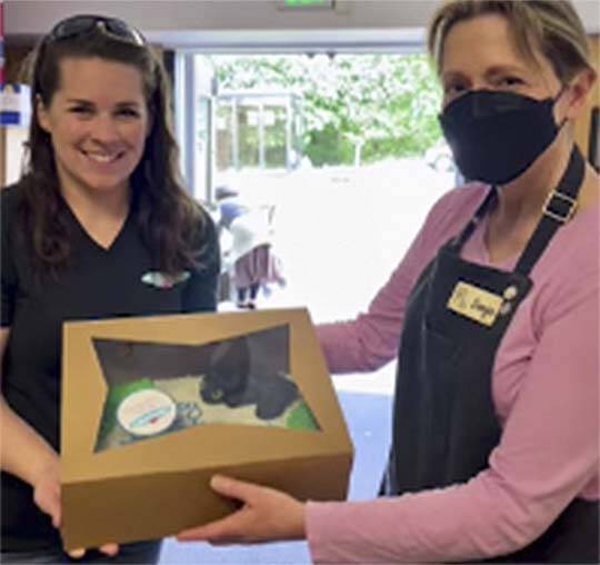 Chelsea Hodgson delivers at cake to the Port Townsend food bank. Courtesy Photo