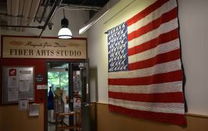 Naomi Spinak's Sweet Land of Liberty quilt is on display near the entrance of the Fiber Arts Studio at the BARN. Nancy Treder/Bainbridge Review