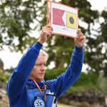 Bainbridge Prepares founder Scott James holds the maritime symbol for Bainbridge Island at the Dock Street landing in Manzanita Bay during the Cascadia Rising earthquake preparedness exercise.