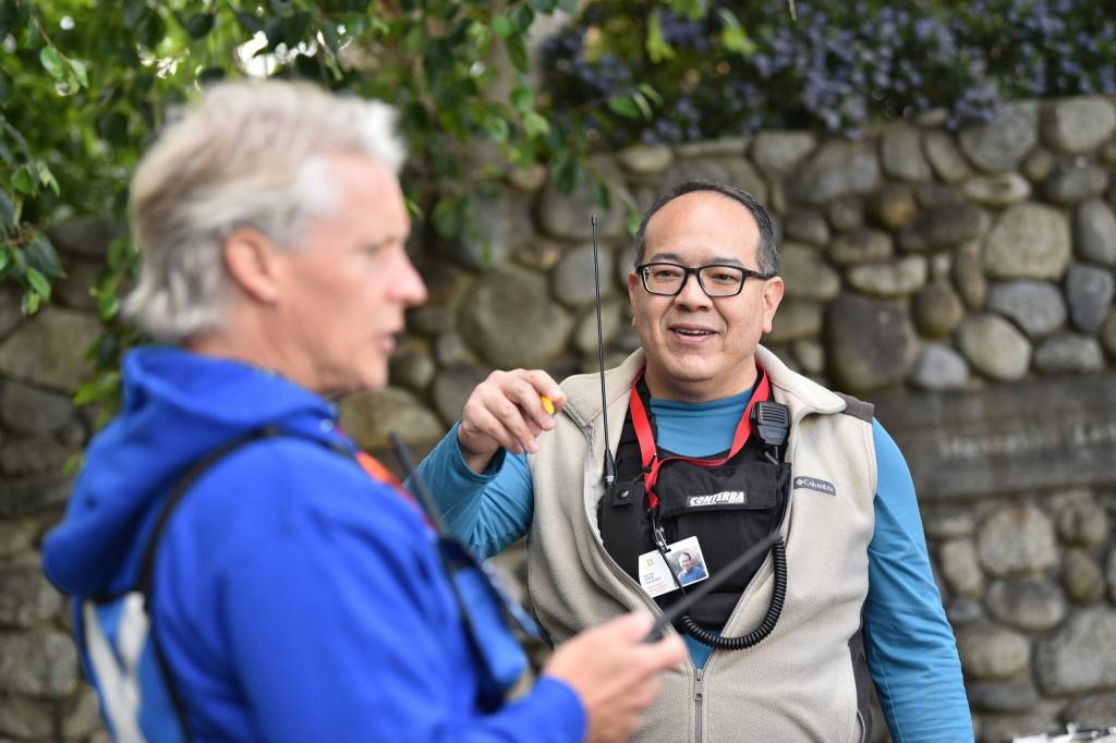Victor Cheng speaks with Scott James during flotilla operations.