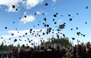 Caps fill the air at the end of commencement June 12 at BHS Memorial Stadium. Nancy Treder/Bainbridge Review photos