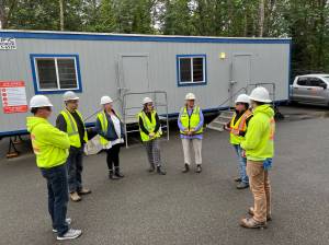 Nancy Treder/Bainbridge Island Review Photos
ReHome project partners gather at the Harrison building construction site to view reclaimed building materials to be reused for three tiny houses at the Morales Farm.