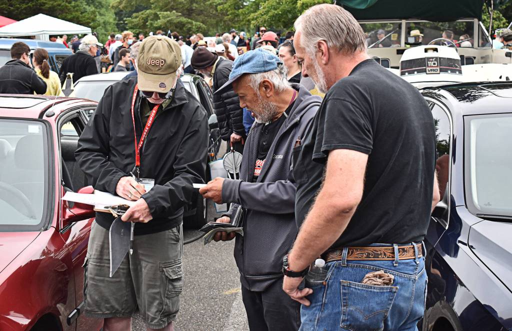 Auction officials keep track of what's going on.