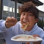 Quarterback Jeff Utter ate some of the pancakes before helping sell them to the public on July 4.