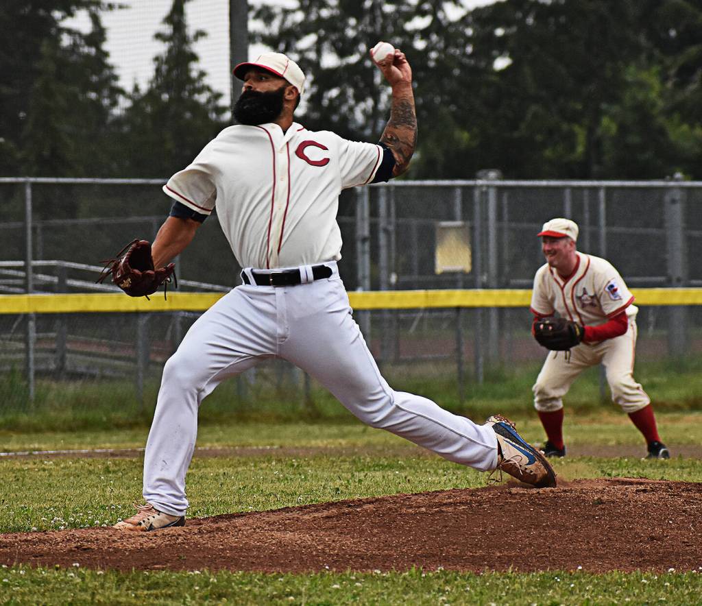 Bainbridge Island head baseball coach Geoff Brown pitched for the Reds team at the old-timers game.