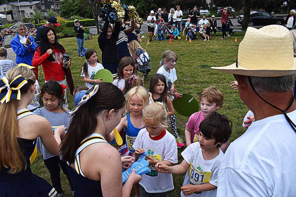 Bainbridge High School cheerleaders handed out ribbons to kids who participated in the fun run.