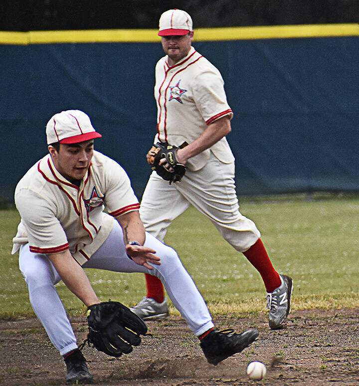 Despite facing a heavy downpour, Bainbridge High School alums took part in the old-timers game.