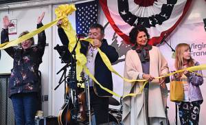 Bainbridge Islands Creative Art District opened with a ribbon-tying event to represent togetherness. Nicholas Zeller-Singh/Bainbridge Review