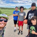 Talking basketball with kids on the Northern Cheyenne Indian Reservation in South Dakota.