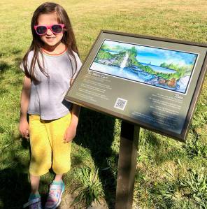 Courtesy Photo
Beatrice of Ordway Elementary on Bainbridge Island looks at one of the artist displays at the new BI Walkabout at Battle Point Park.