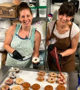Mike De Felice/Bainbridge Island Review
Natalie Smith and Nina Zubal enjoy baking for Dudes Donuts.