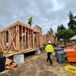 Clark Construction employees frame the tiny houses.
