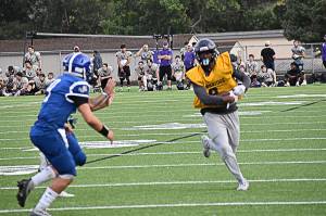 Bainbridge's Micah Bryant picked up several yards as running back and earned two pass breakups as defensive back. Nicholas Zeller-Singh/Bainbridge Island Review Photos