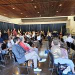 Members of the Jewish community from North Kitsap County and Bainbridge Island celebrate the new community Torah.