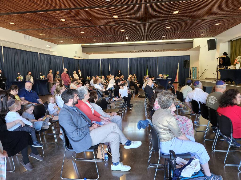 Members of the Jewish community from North Kitsap County and Bainbridge Island celebrate the new community Torah.