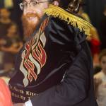 Rabbi Mendy Goldshmid carries the sacred Torah during the ceremony hosted by the Chabad Jewish Center of Bainbridge Island and North Kitsap.