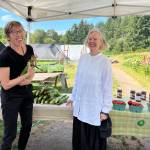 Nancy Treder/Bainbridge Island Review
Ann Strickland and Mary Anderson chat about how farmer Brian MacWhorter provided produce for people during the pandemic.