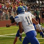 Jack Grant dives for the pylon to give the Spartans an early lead.