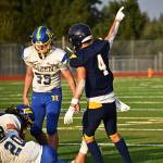Luke Lavigne celebrates when the Spartans force and recover a fumble in the first quarter.